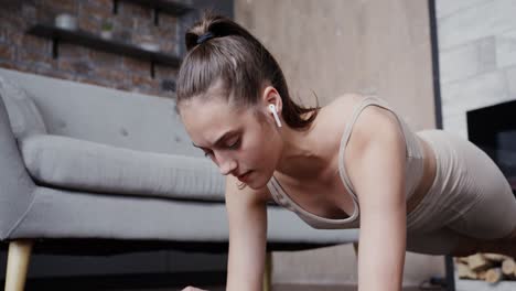 woman doing a plank exercise at home