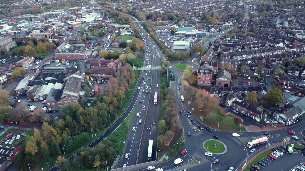 Aerial View of a Highway and Roundabout in an Urban Area