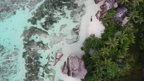 aerial view of anse source d’argent, la digue, seychelles shot in the early morning hours with no people on the beach