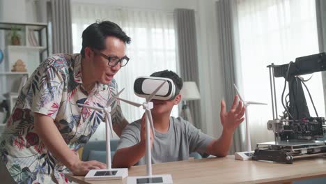 father and son learning about renewable energy with vr and 3d printing