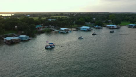 Boats-and-boathouses-on-a-lake-on-a-summer-evening