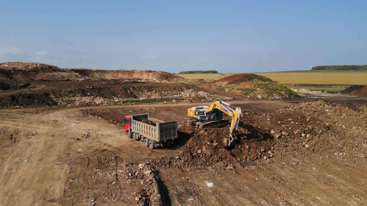 Excavator Loading Dump Truck in a Quarry