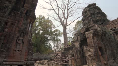 cambodia, angkor wat famous ruins with elaborated wall carvings. panning shot