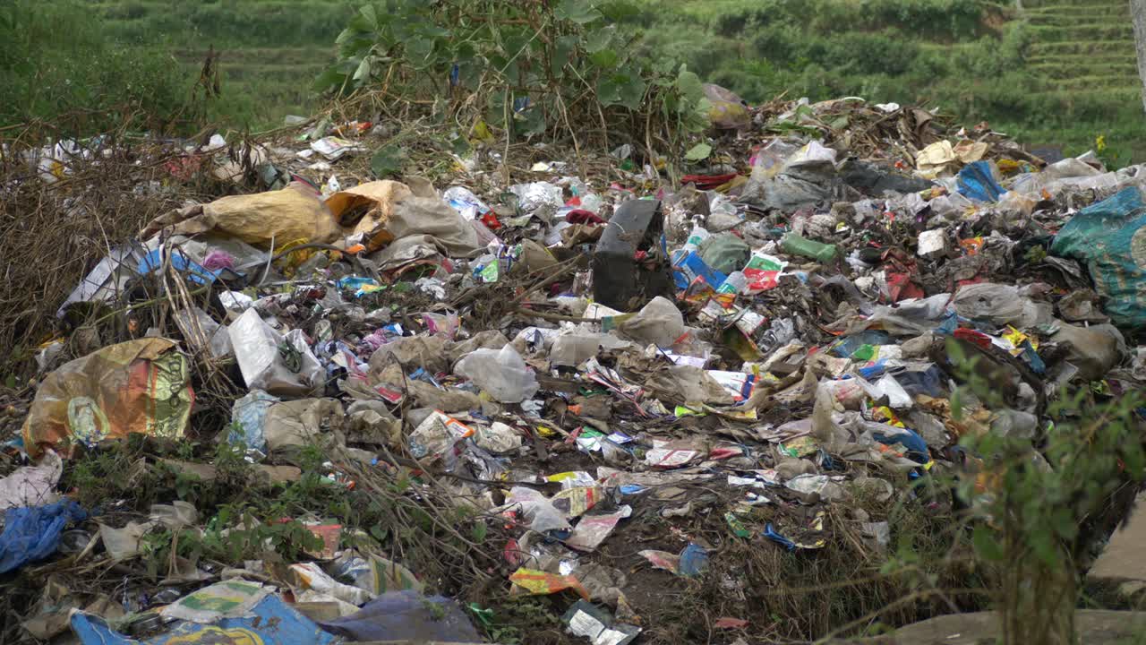 Plastic and industrial waste dumped on agricultural land