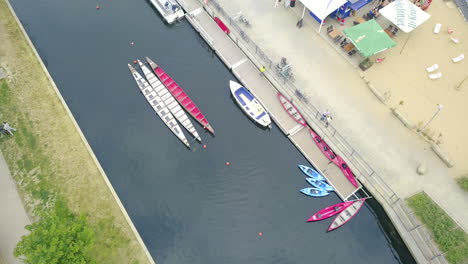 drone flying above a river with birdseye view on canoe