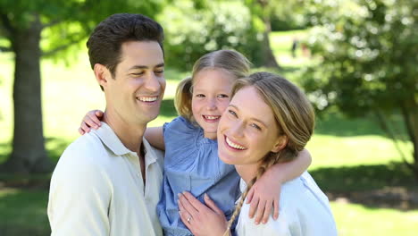 Happy-parents-with-their-little-girl-in-the-park