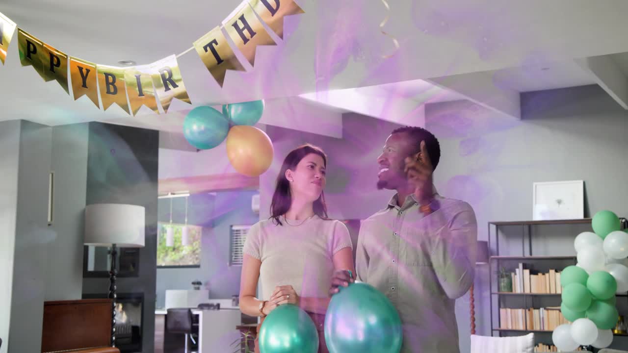 Man blowing teal balloon and woman fastening clusters, purple overlay guiding 30th birthday setup