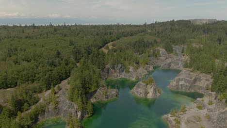 beautiful aerial view of the colorful lakes in the canadian nature during a sunny summer day