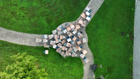 Chairs-and-desks-in-pile-outside-school