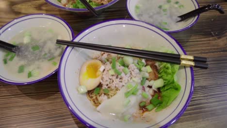 traditional asian singaporean noodles soup in slow motion meepok with egg and minced meat 1