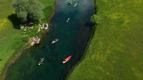 kayaks journey down gacka river, lika region aerial view of croatia