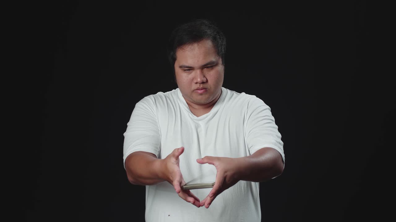 Asian Man Shuffling Cards, Cardistry On Black Background