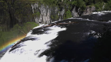 Still-shot-of-a-rainbow-nearby-the-Upper-Mesa-Falls-waterfall-in-Idaho,-USA