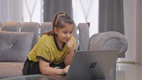 Confused-Indian-kid-girl-using-Laptop