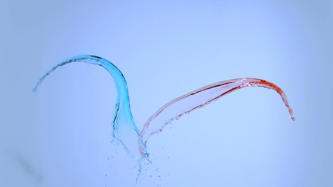 Coloured water splashing in super slow motion