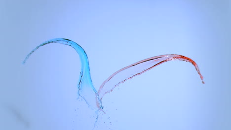 coloured water splashing in super slow motion