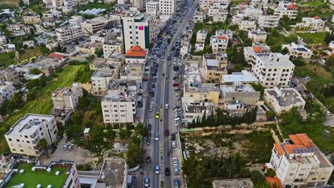 aerial view of cars driving through the city of hebron in palestine