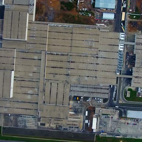 manufacture on field. industrial zone with car parking. roofs of industrial buildings. large factory outdoors. top view.