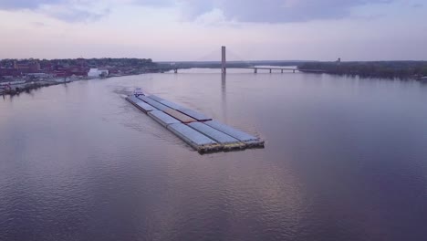 a beautiful aerial of a barge traveling on the mississippi river 1