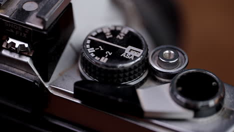 a pan of an old film camera on a table