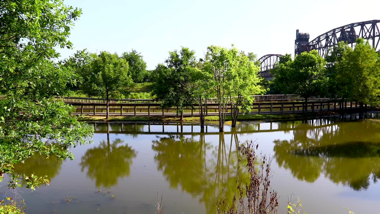 Static video of William E. Clark Presidential Park Wetlands and Arkansas Park Trail Bridge