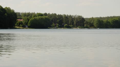 calm waters of glebokie lake at daytime in sitno, kartuzy, poland