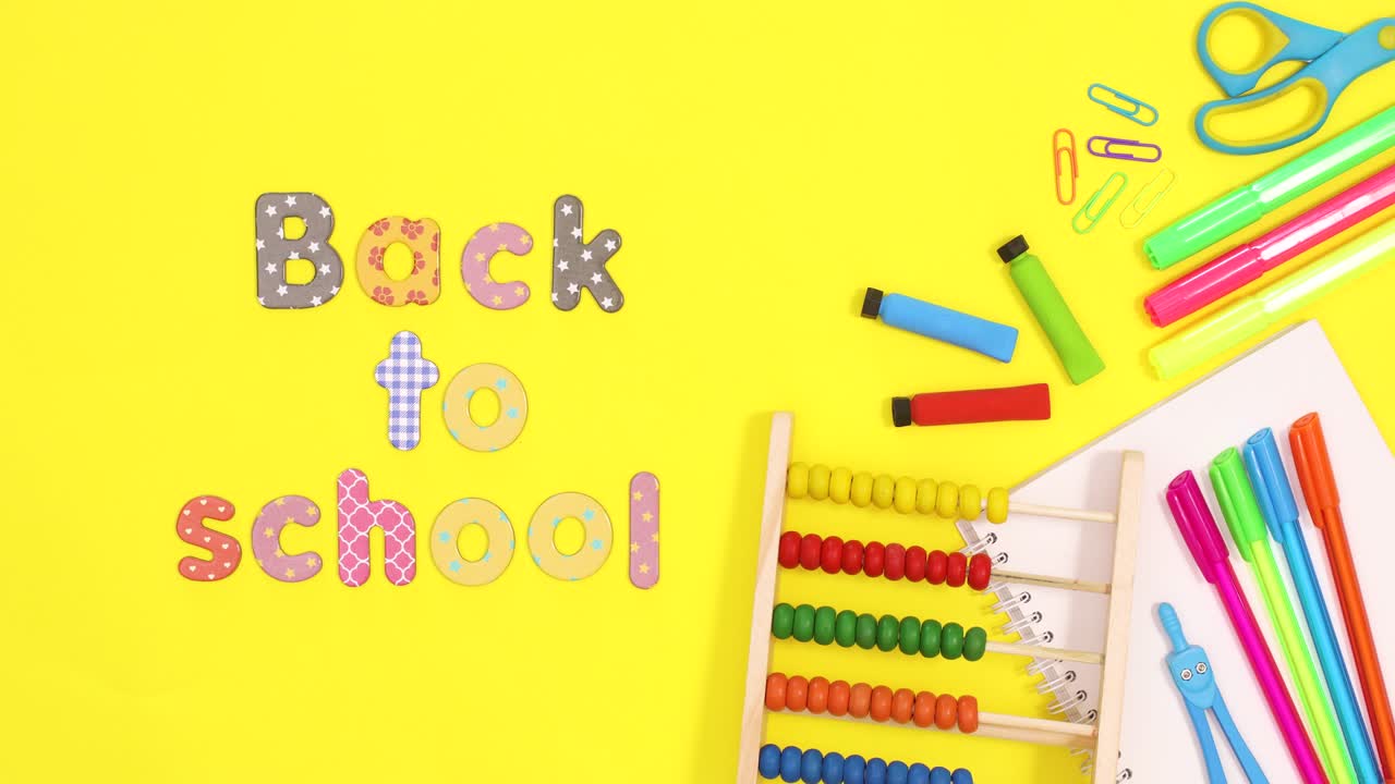 Vibrant school stationery appear on right side of yellow theme with back to school text. Stop motion