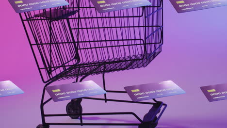 animation of credit cards over shopping cart on purple background