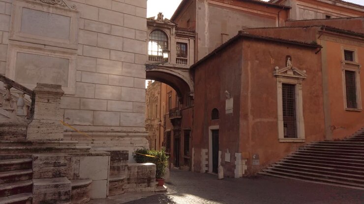 walking toward a a renaissance skybridge connecting the city hall of Rome with another historical building close to the world famous capitoline hill, masterpiece of Michelangelo