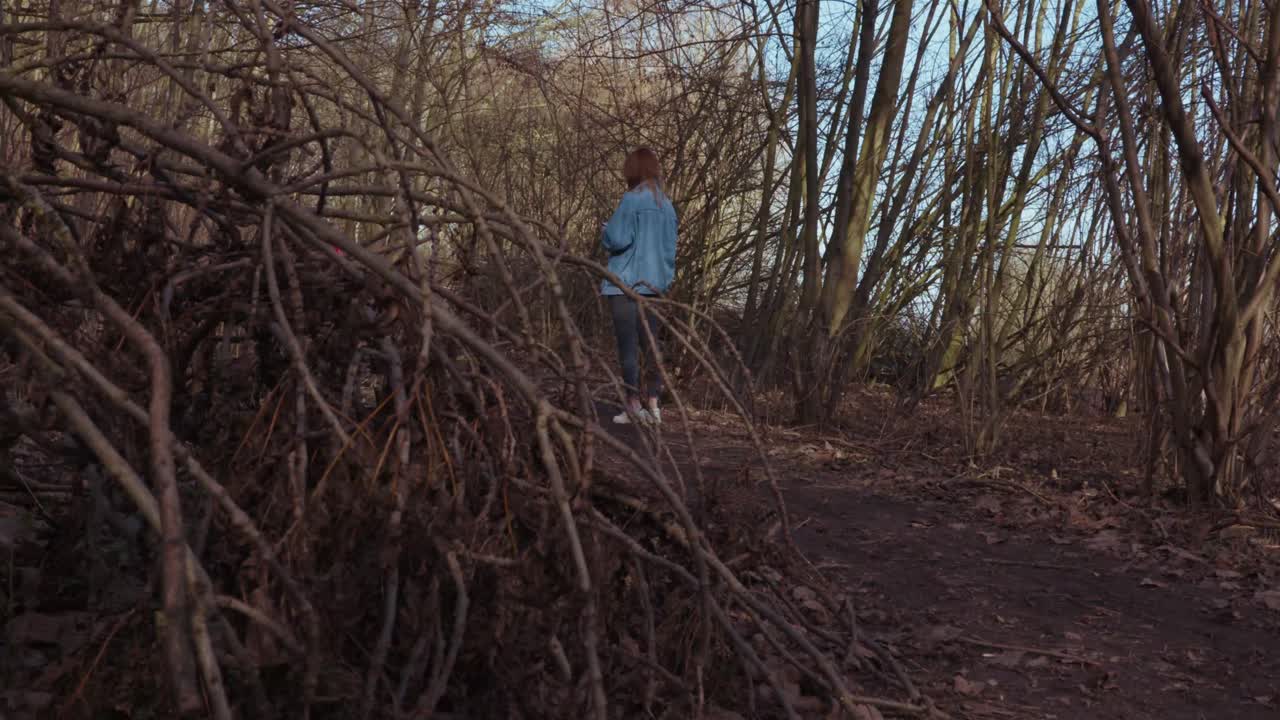 Girl standing alone in the Woods