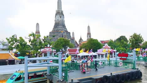 boats and people near wat arun temple