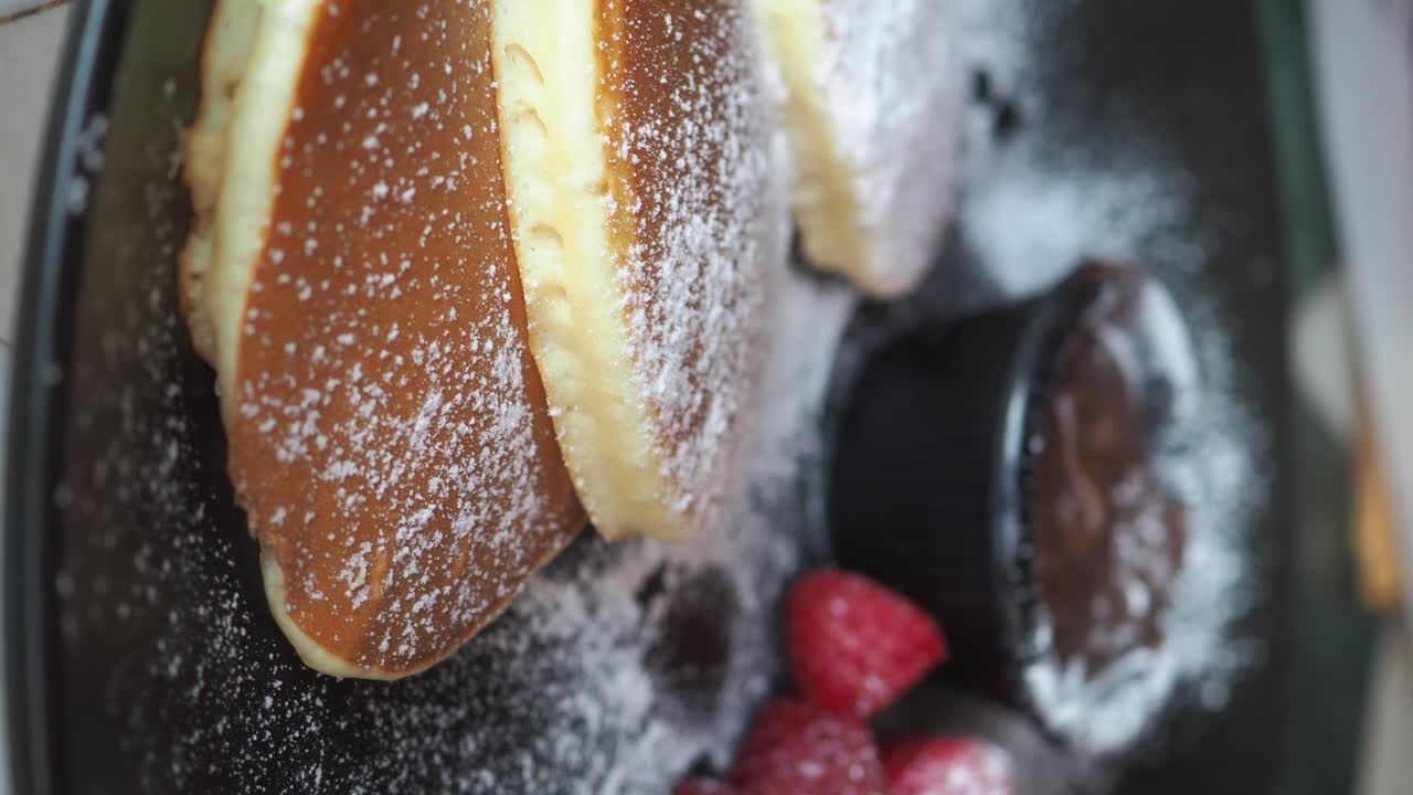 Fluffy Soufflé Pancakes with Raspberries and Chocolate Sauce