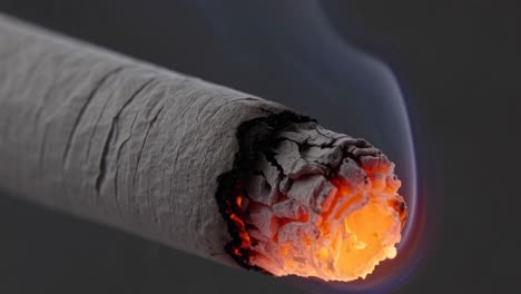 the video captures a close-up of a burning cigarette, emphasizing the glowing ember and smoke