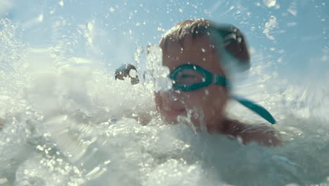 Happy-little-child-enjoying-water-splashing