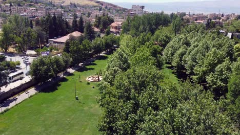 massive manicured garden of ras el ein park in lebanon - aerial shot