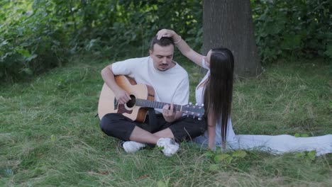 couple enjoying music together in nature
