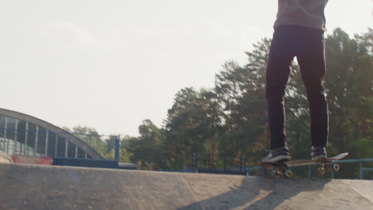 Young Man Skating on Ramp in Summer