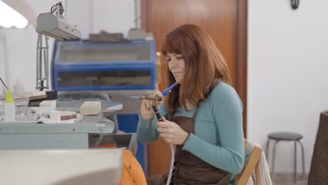 woman jewelry maker at work