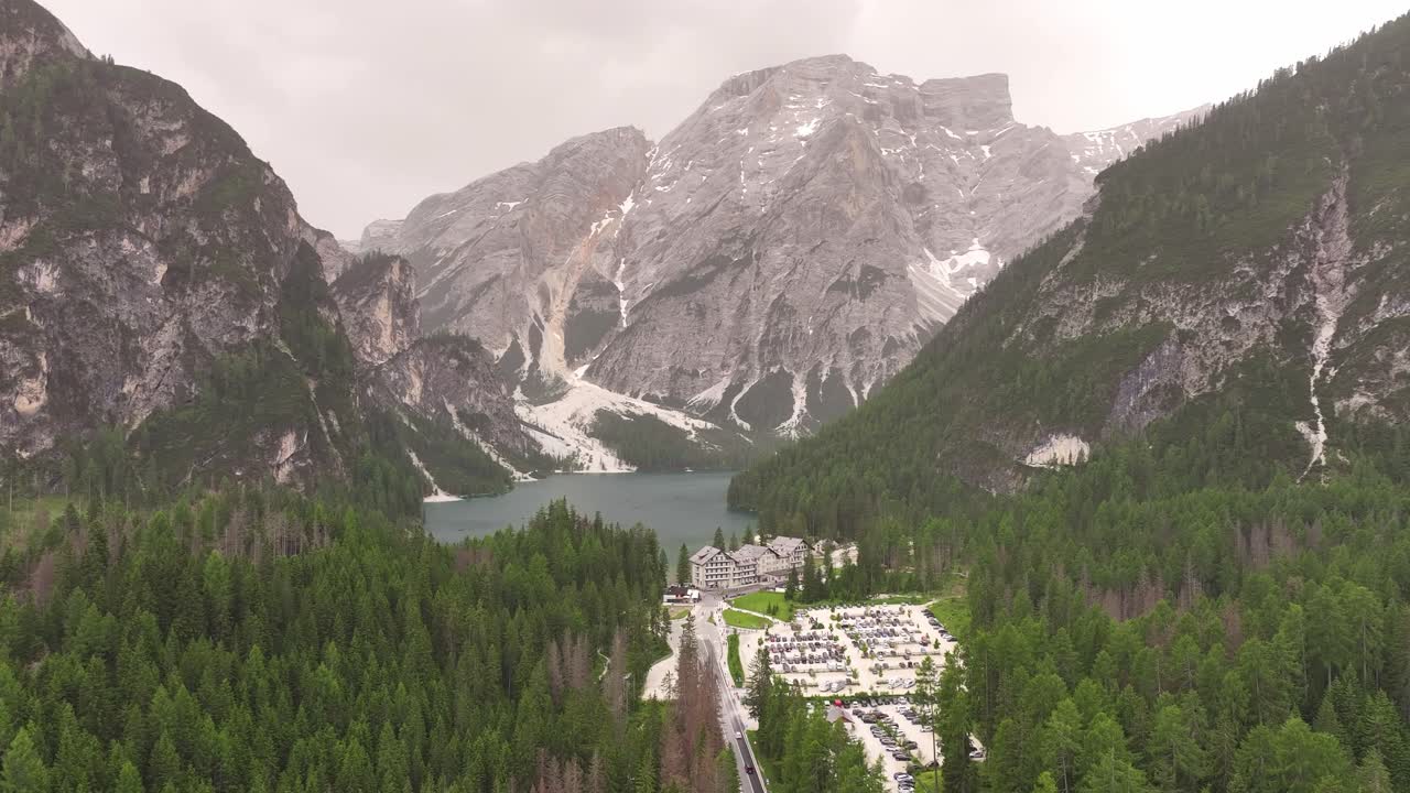 Lake Pragser Wildsee Italy Dolomites mountains valley, aerial evergreen spruce tree forest