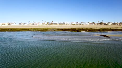 aerial, pan, a long thin sand bar offers sea birds a place to land, rocky point, puerto peñasco, gulf of california, mexico