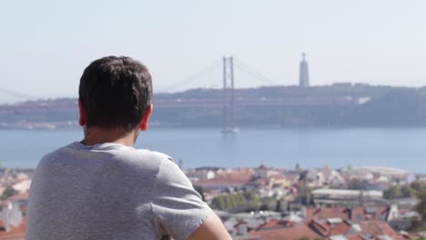 on the coastline, a man gazes at the worldwide setting where world youth days transpired, fostering an energetic assembly of global youth, united in purpose