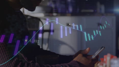 animation of diagrams and data processing over biracial businessman using smartphone