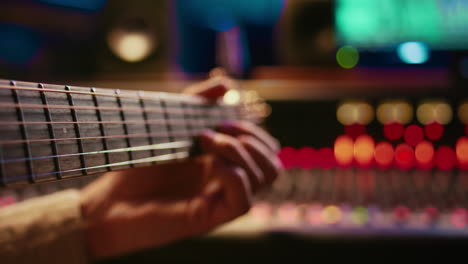 artist composer creating a new song on his electro guitar in studio