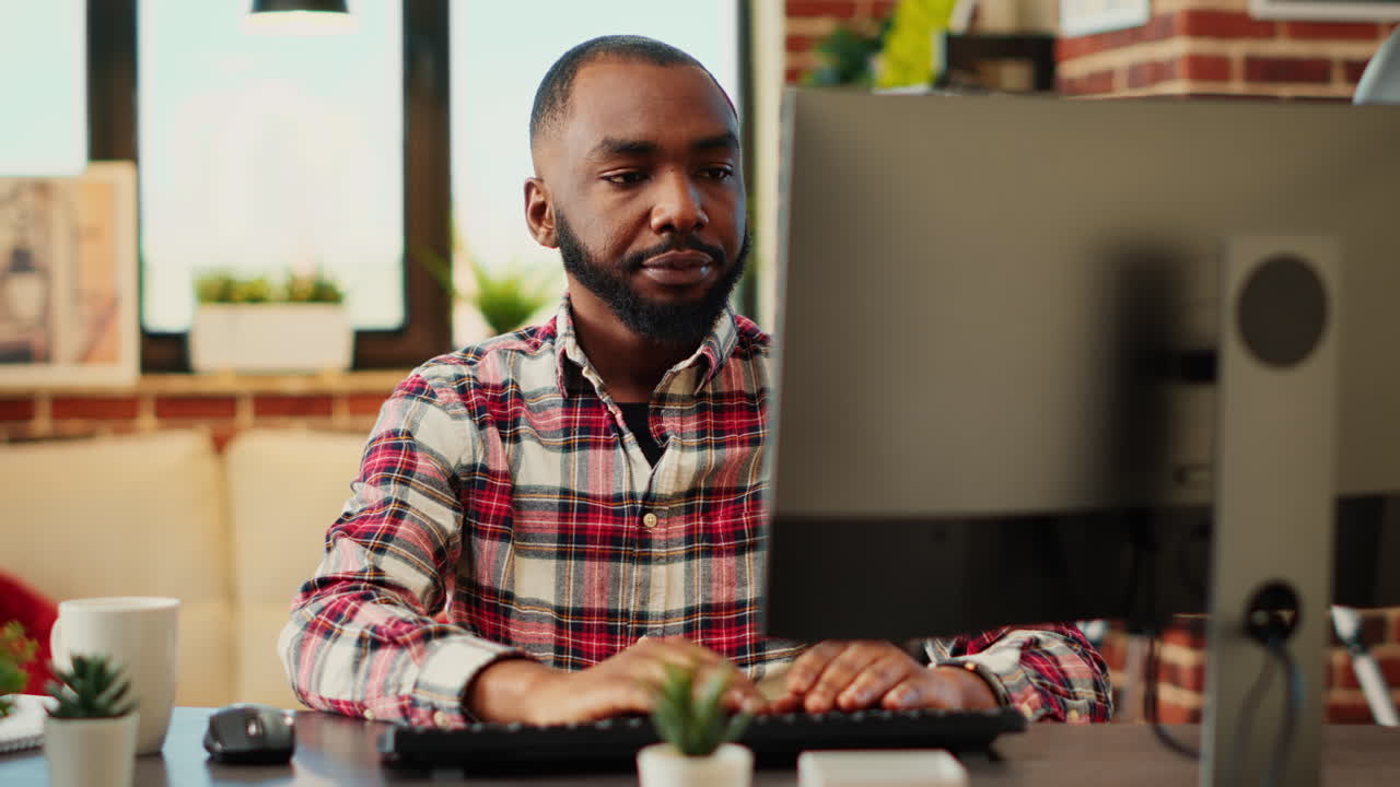 Man working at a computer in an office