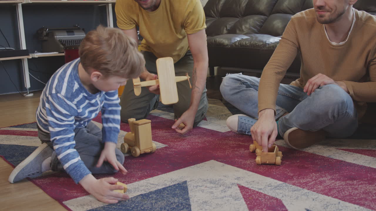Fathers and Boy Playing with Toys