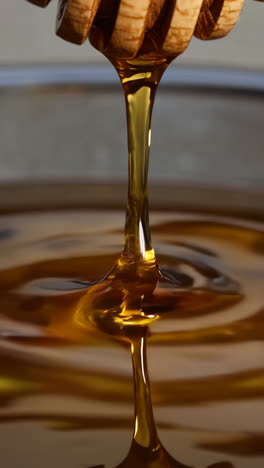 honey dripping from a dipper