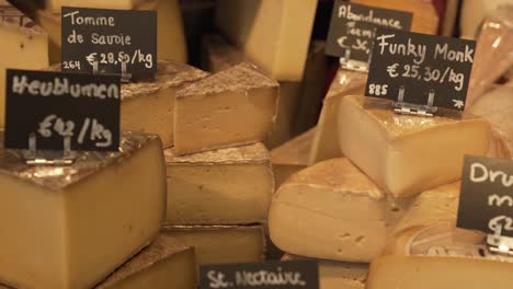 assortment of french cheeses at a market