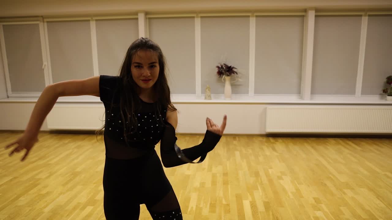 Close up shot of a good looking young woman doing a provocative dance routine