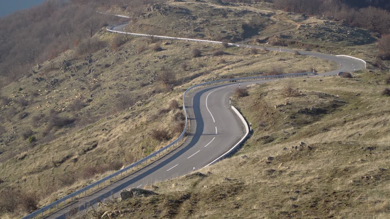 A view of a twisty curved mountain road