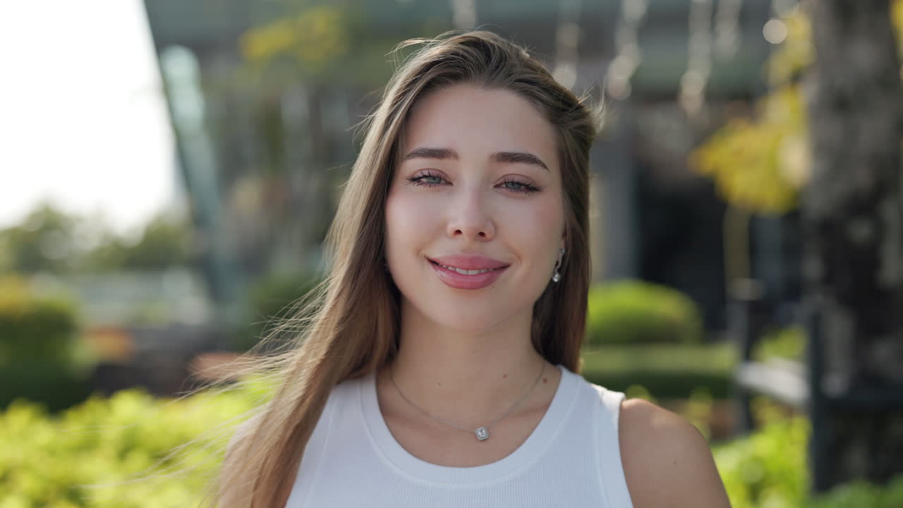 Portrait of a Beautiful Young Woman in a Garden